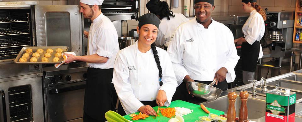 MCC students preparing foods in the culinary kitchen lab